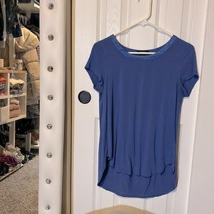 Elevate your style with this gently used Alfani high-low tee with a satin trim